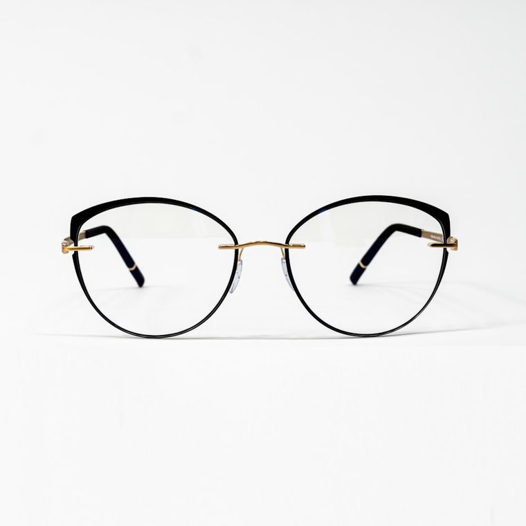 Montura cat-eye de metal negro y dorado
